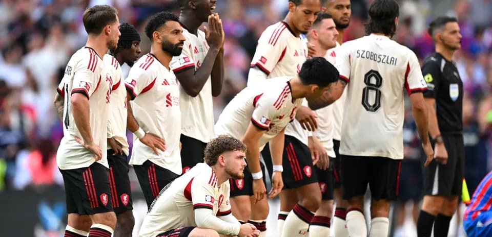 Team in white jerseys preparing for a free kick