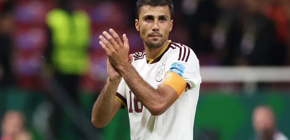 Player applauding fans after a match