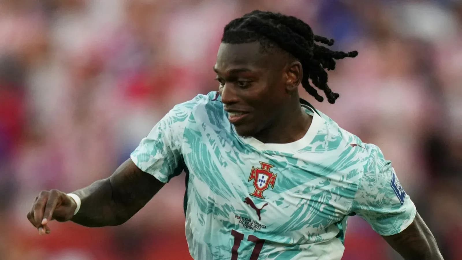 Player running with ball during football match