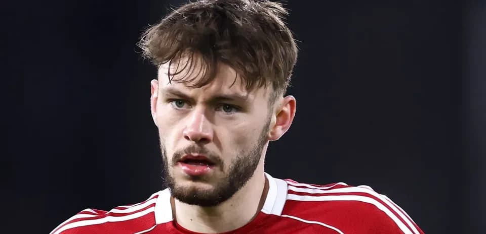 Player wearing red jersey during match close-up