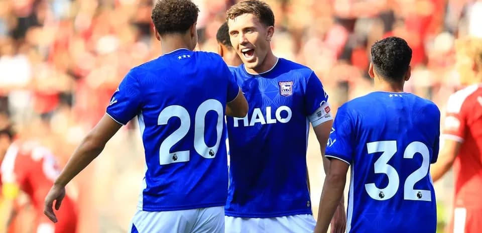Players celebrating together during a football match