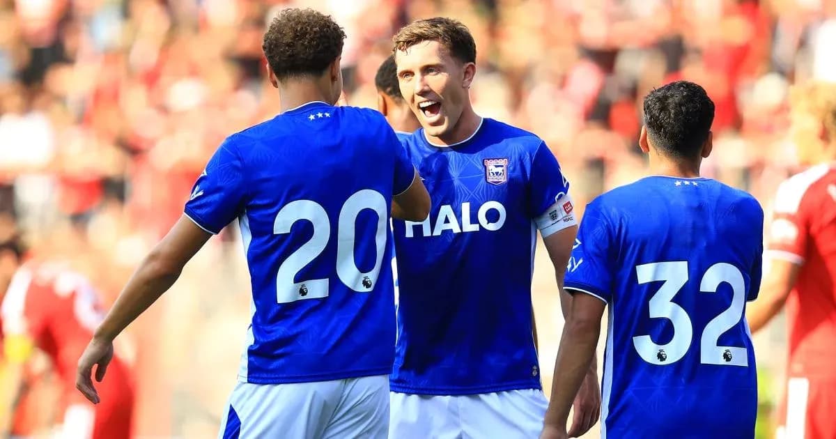 Players celebrating together during a football match