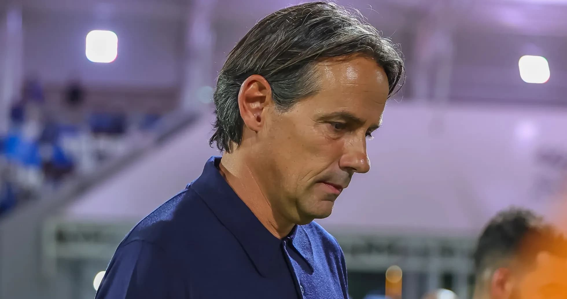Coach walking on the sideline during a match