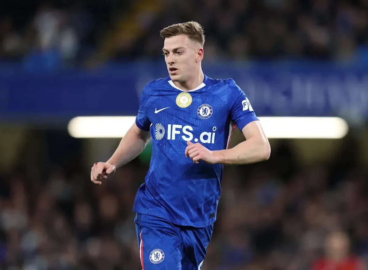 Player in blue Chelsea kit running on the pitch