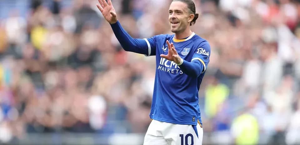 Player celebrating in Everton blue jersey at stadium