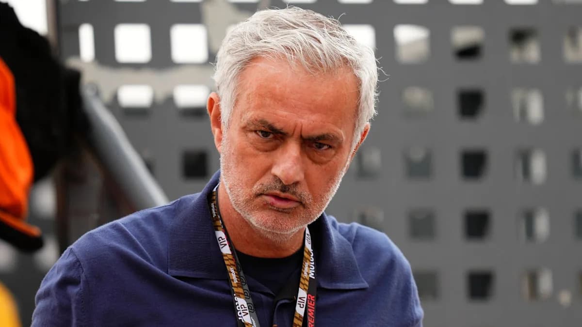 Coach in a blue shirt at event