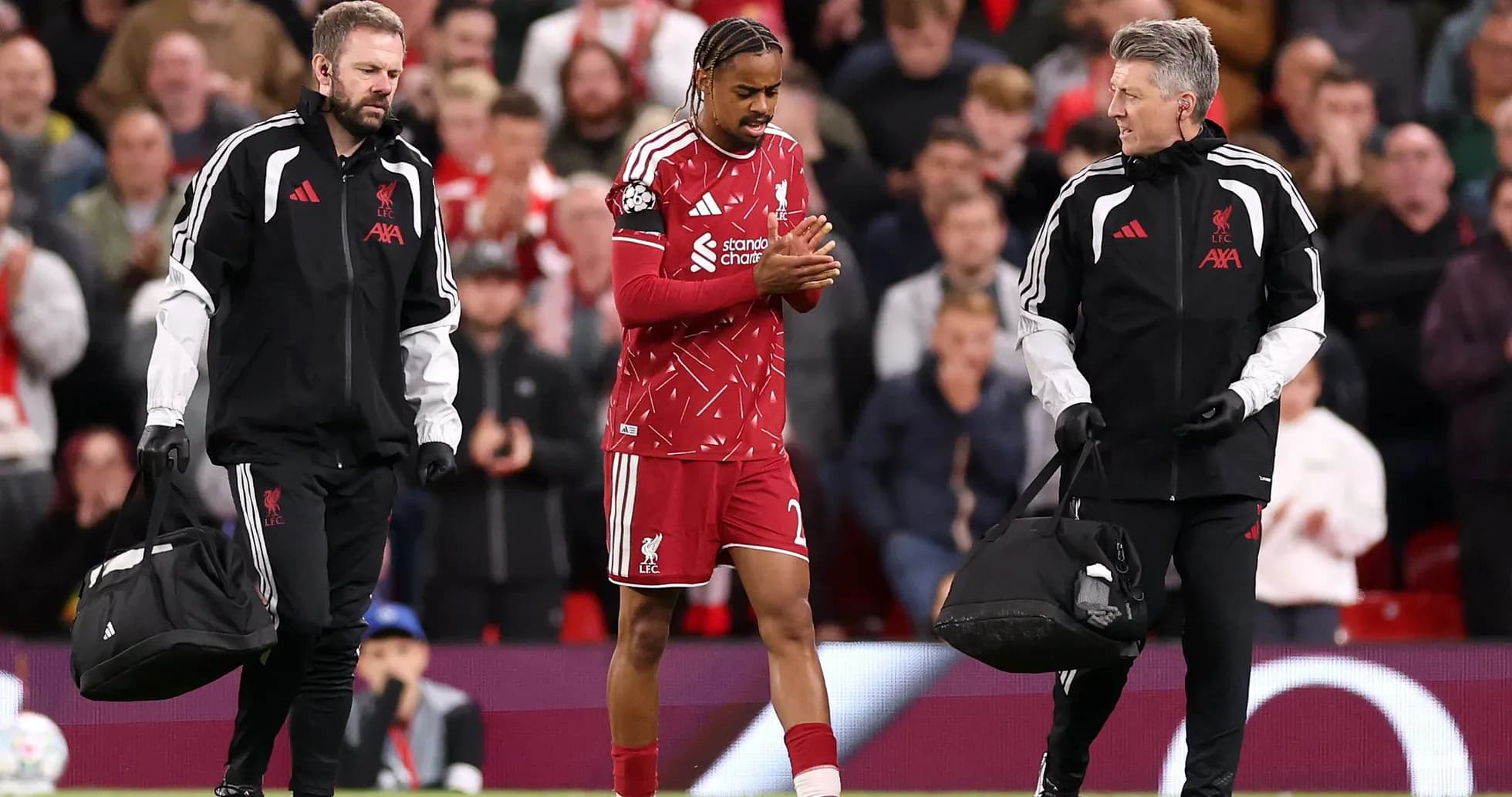 Player leaving the field with medical staff assistance