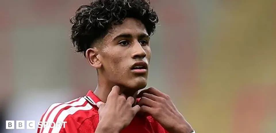 Young player adjusting his collar during match