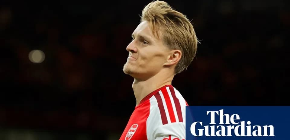 Arsenal player looking thoughtful on the field