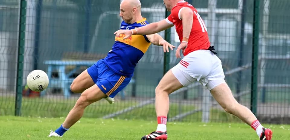 Two players competing for the ball on field