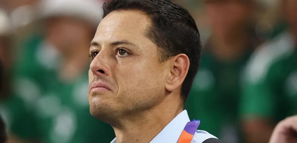 Player with tears watching the match in background