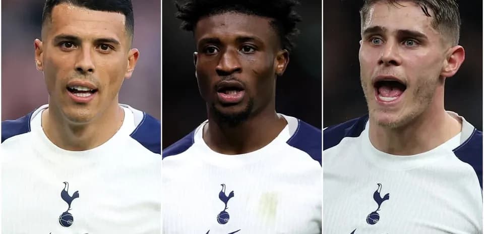 Three Tottenham players in team kits during match