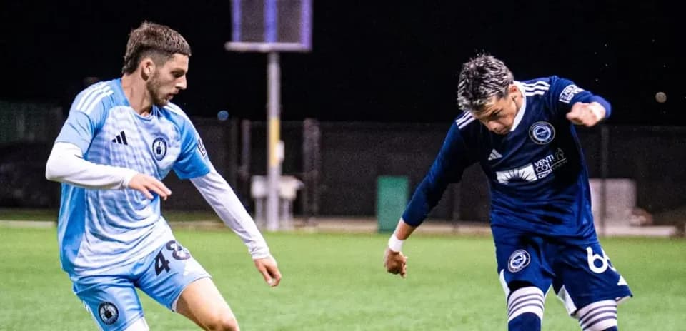 Players contesting for the ball during match