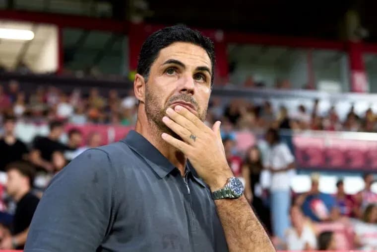 Coach observing the match with thoughtful expression