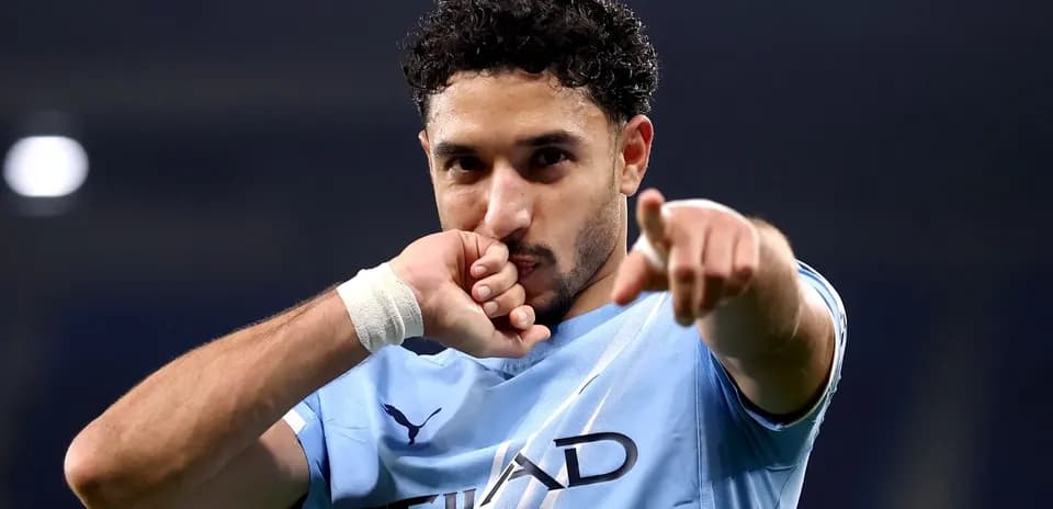 Player celebrating and pointing after scoring goal