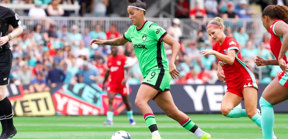 Player dribbling the ball during NWSL match