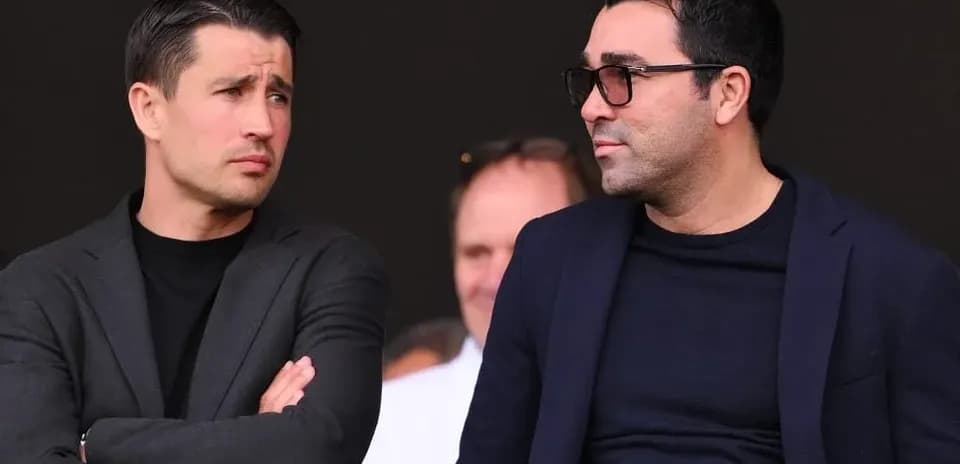 Two men discussing during a sports event