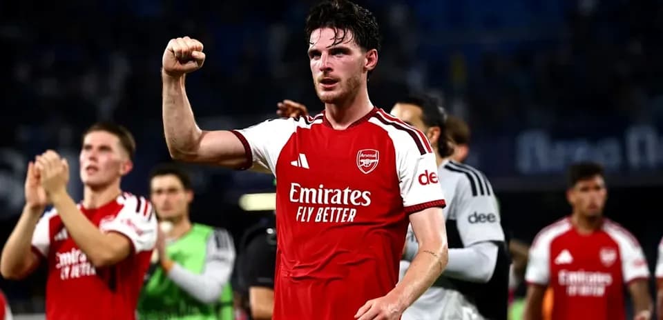 Arsenal player celebrating with raised fist after match