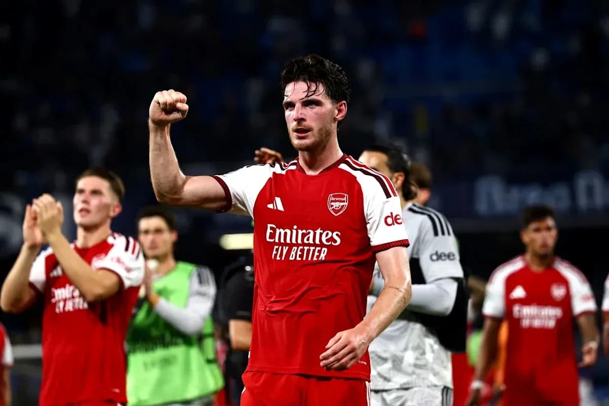 Arsenal player celebrating with raised fist after match