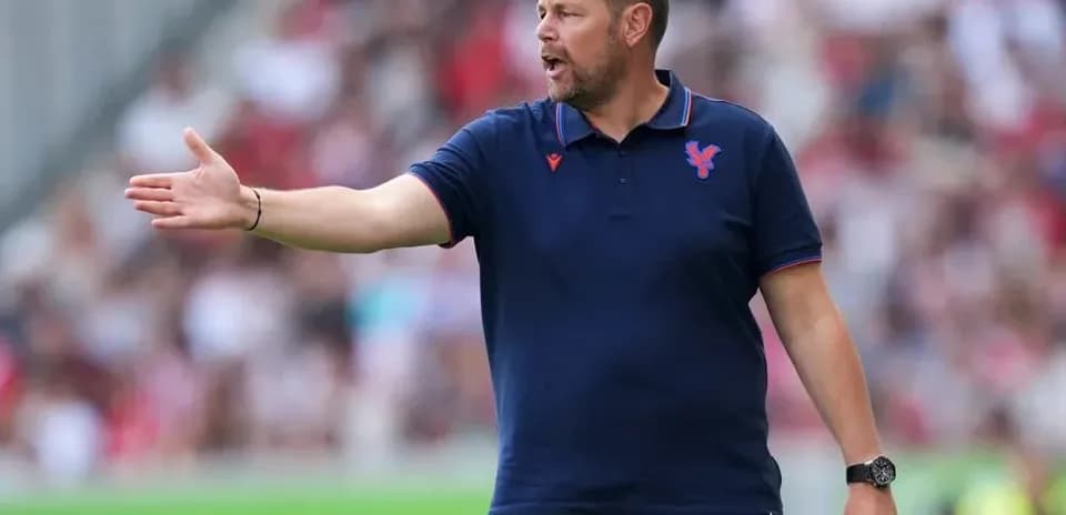 Manager directing players from the sidelines during match