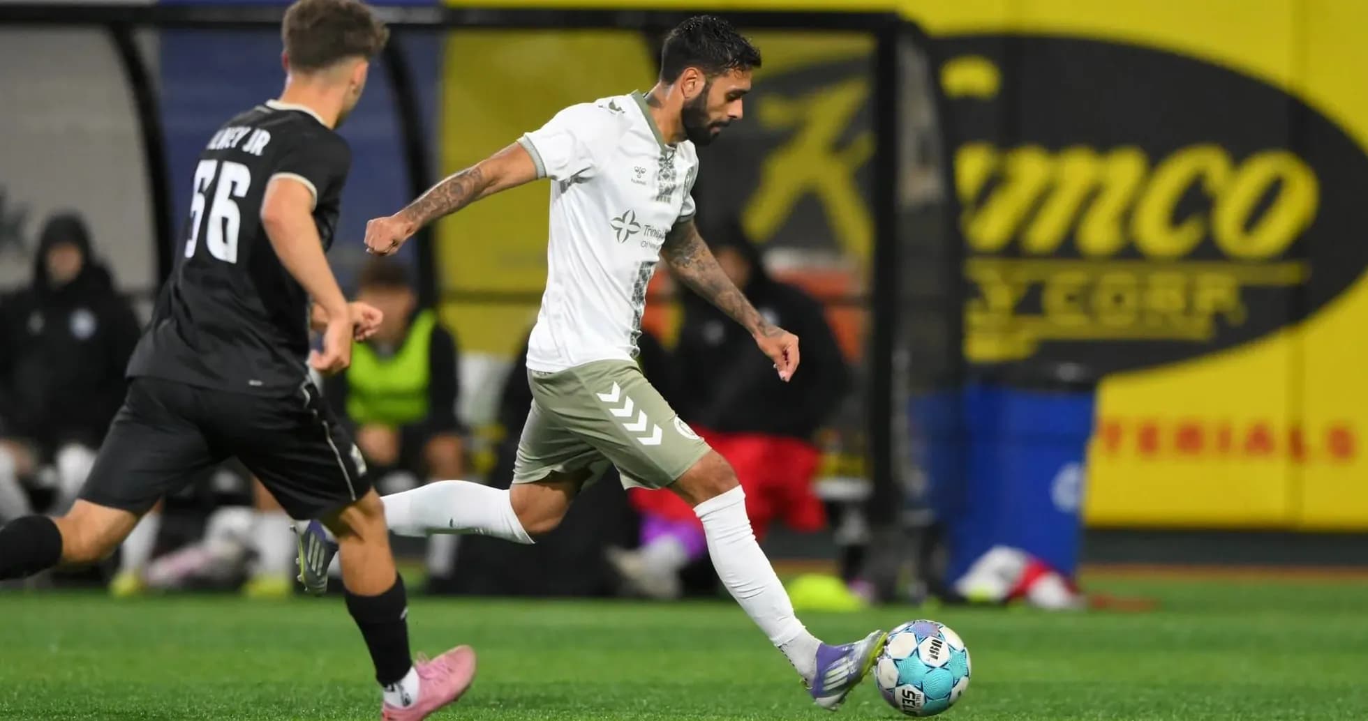NY Cosmos player dribbling past Hartford Athletic opponent