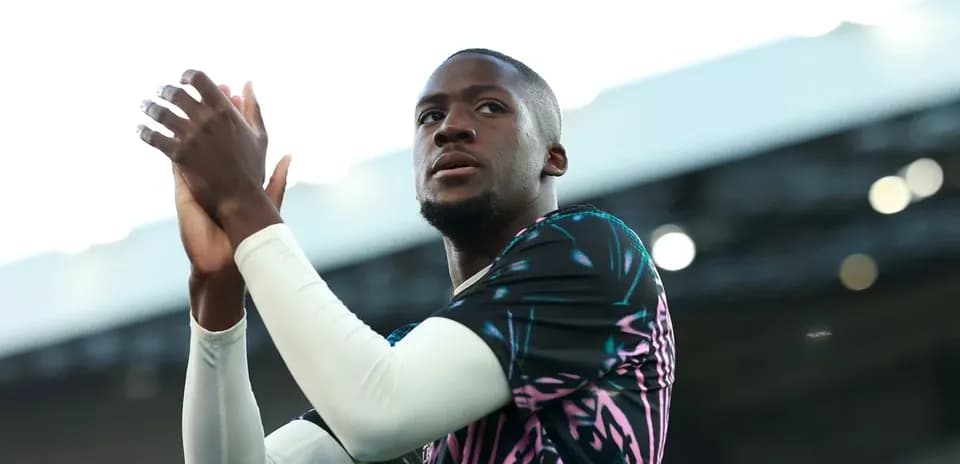 Player applauding fans during match warm-up