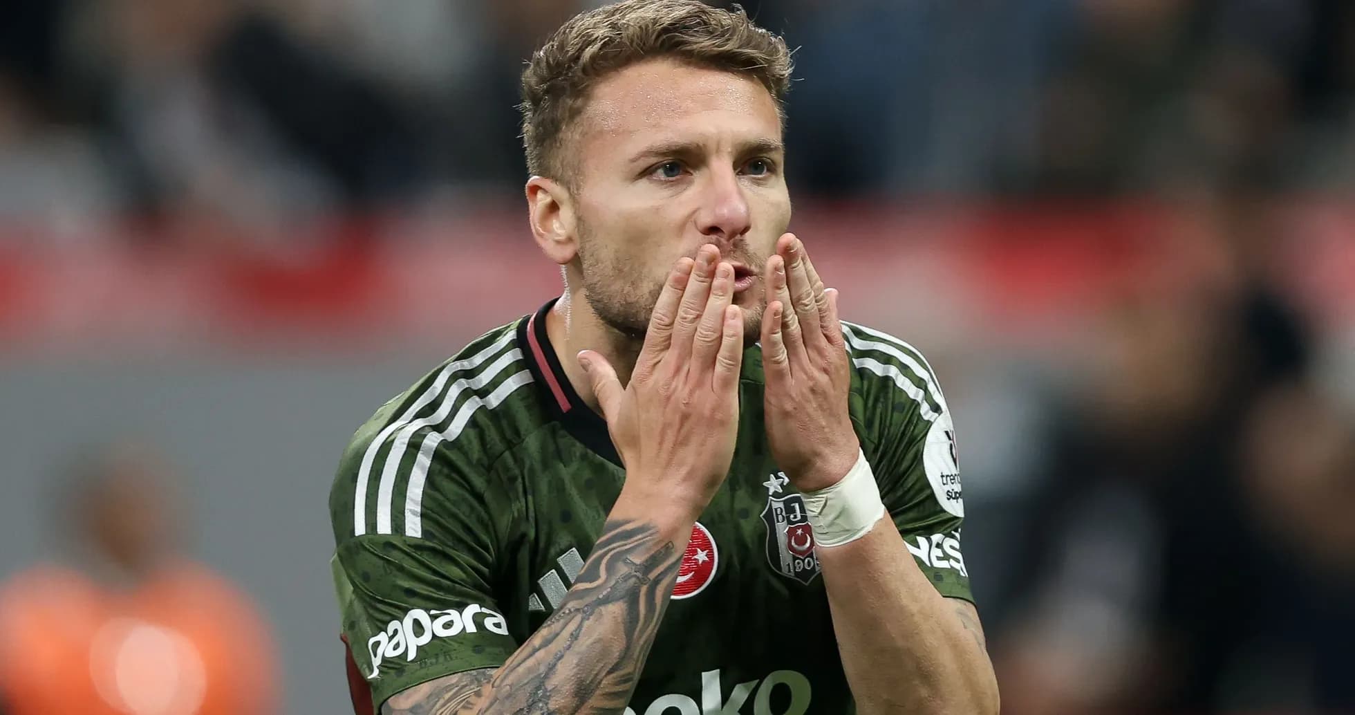Player blowing kisses during match celebration