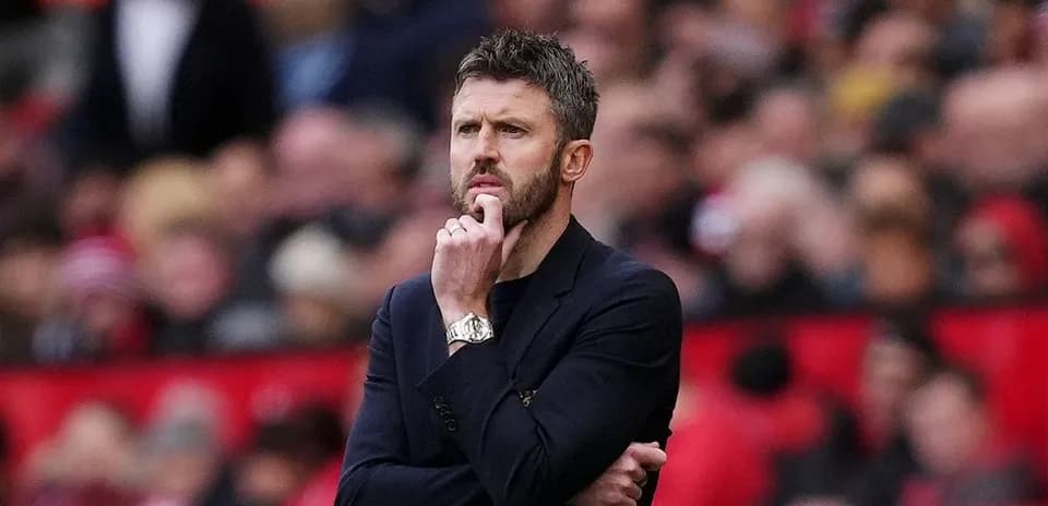 Manager contemplating during a match on the sideline