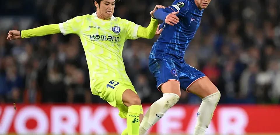 Two players battling for the ball during match