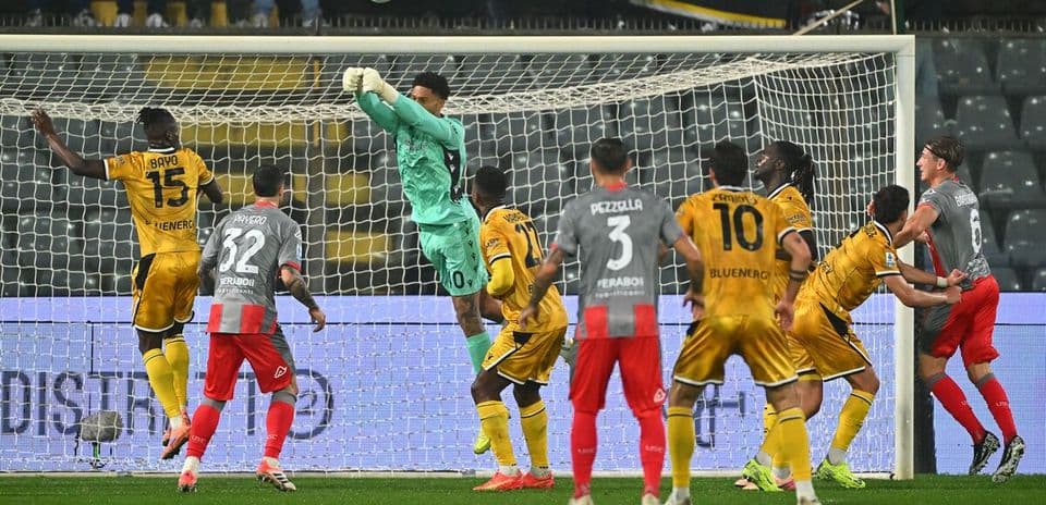 Goalkeeper making a save during Udinese match