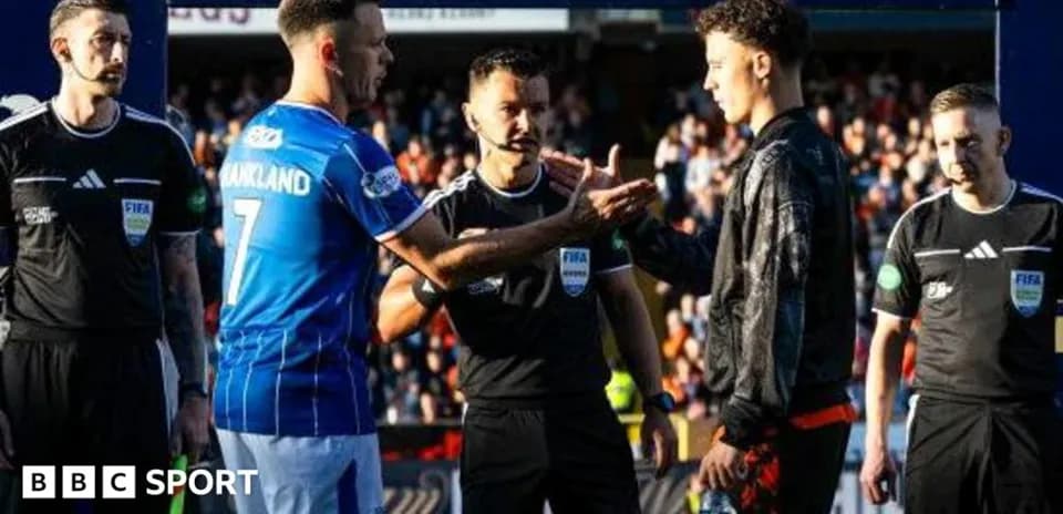 Players and referees shaking hands before match