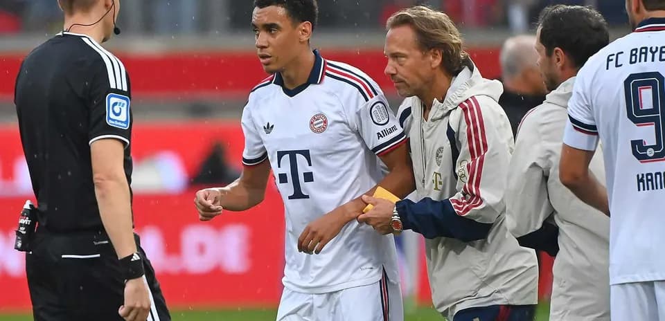 Bayern Munich player receiving medical attention on field