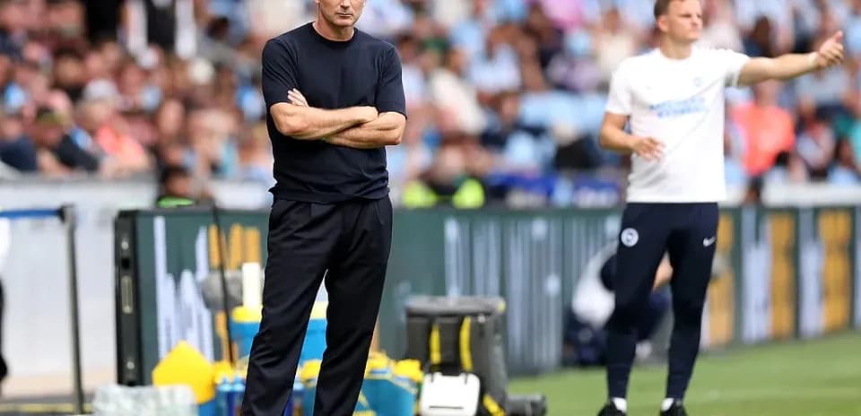 Coaches observing match from the sideline
