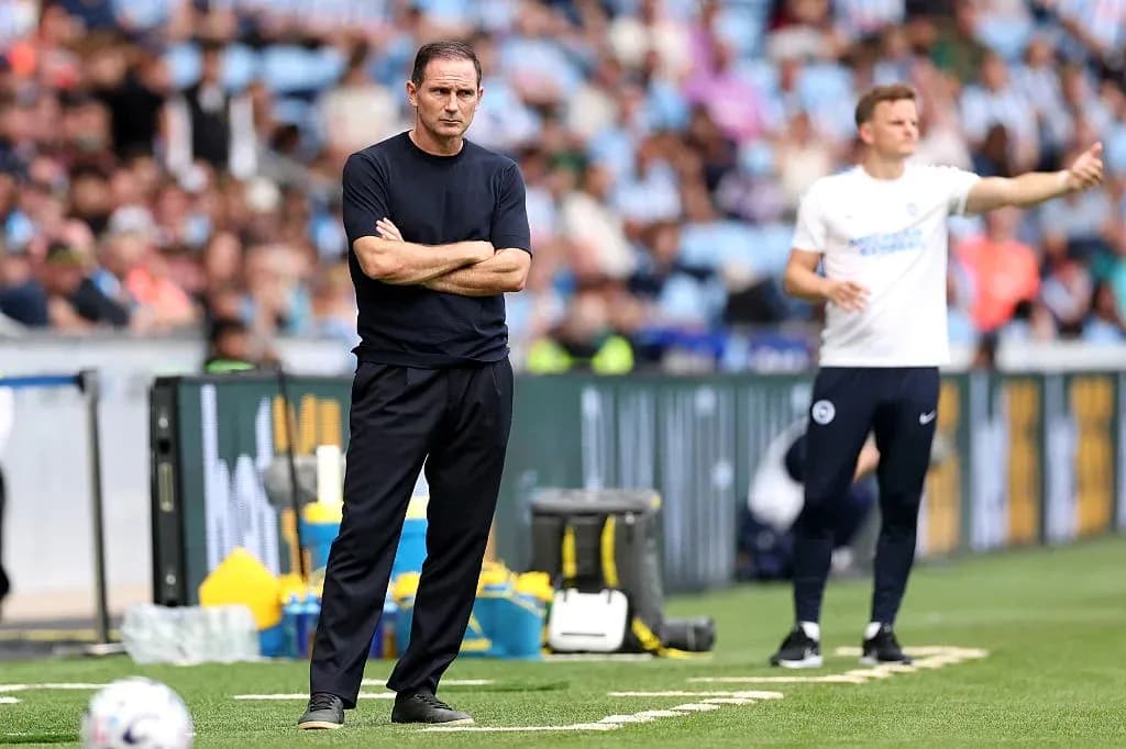 Coaches observing match from the sideline