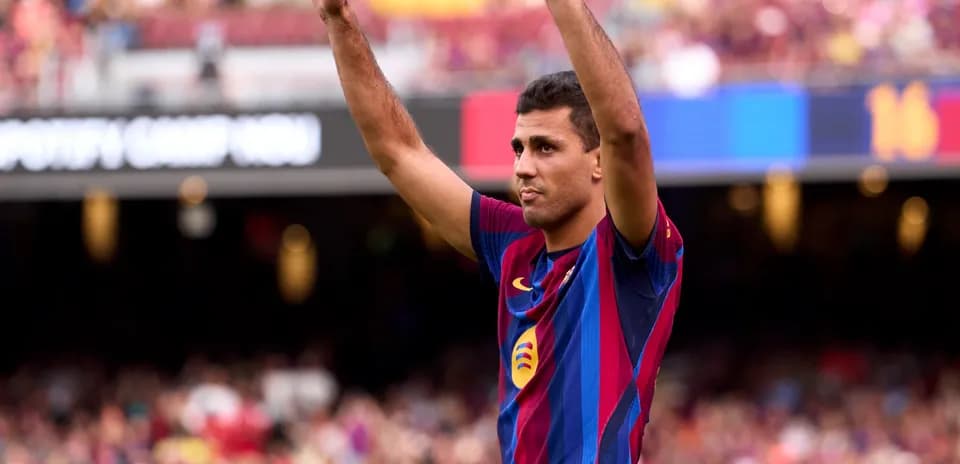 Player celebrating in FC Barcelona jersey at Camp Nou