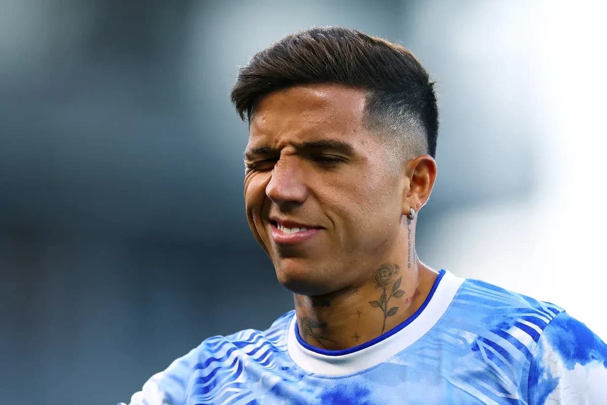 Player in blue jersey squinting during warm-up