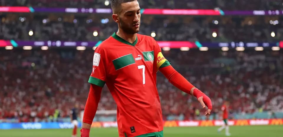 Morocco player wearing red jersey during match