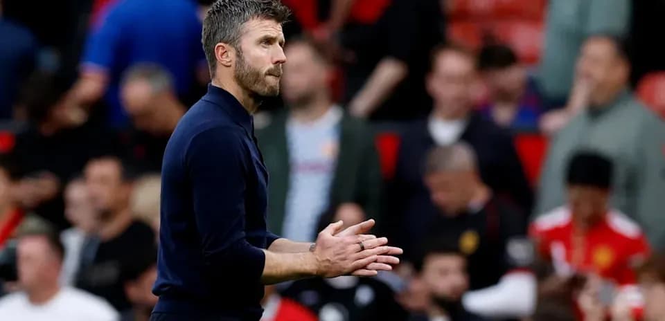 Coach applauding during match at stadium
