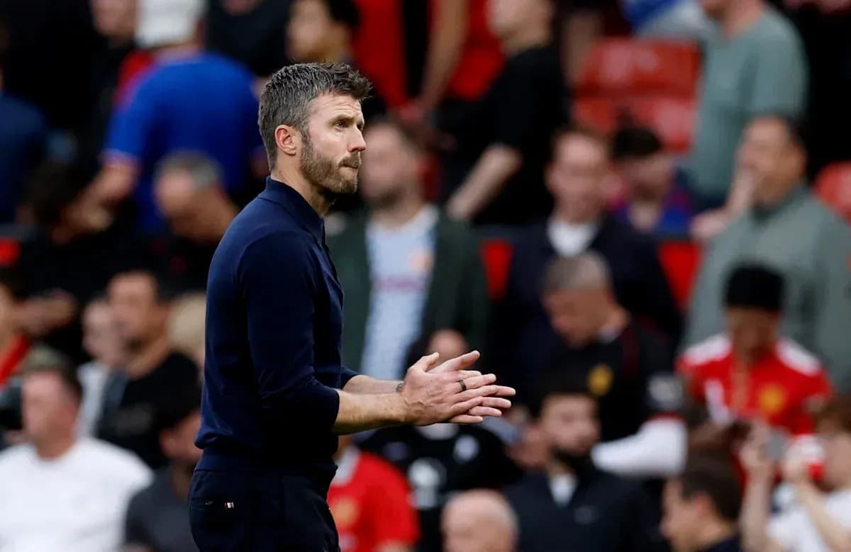Coach applauding during match at stadium