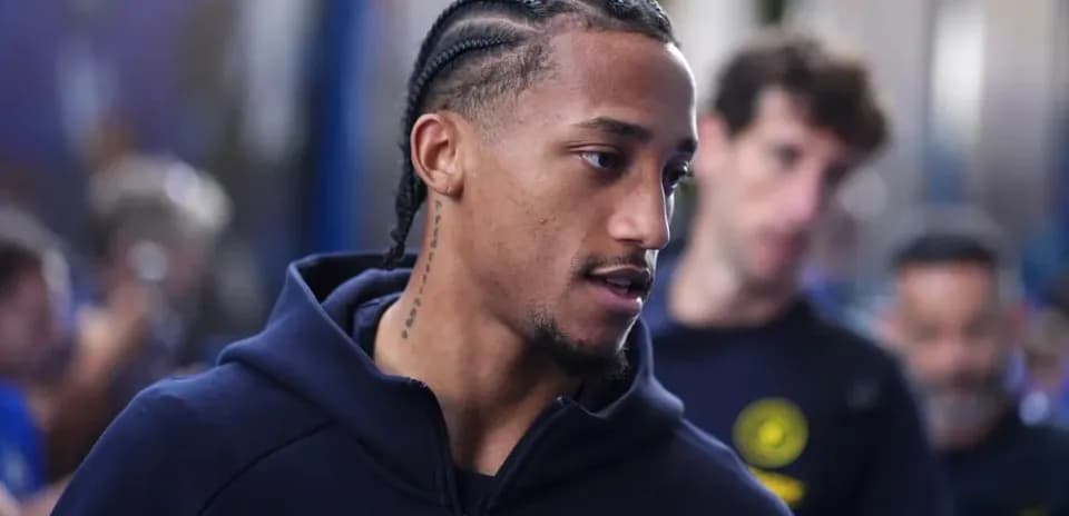 Player with braided hair arriving at venue