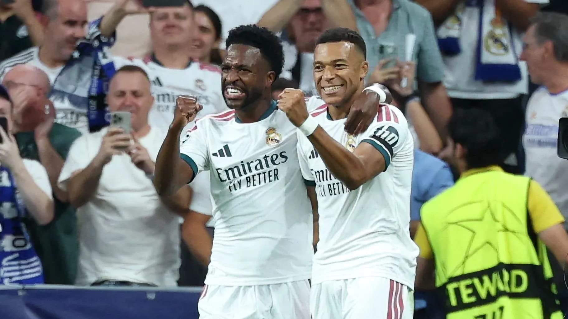 Two Real Madrid players celebrating a goal together