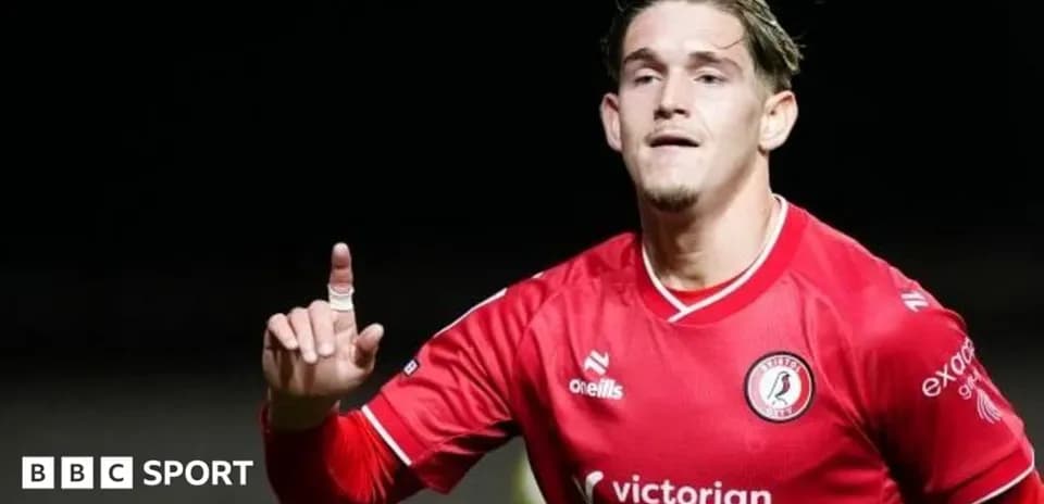 Player celebrating a goal in red team jersey