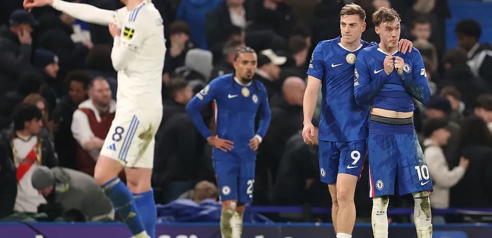 Chelsea players showing disappointment after match conclusion