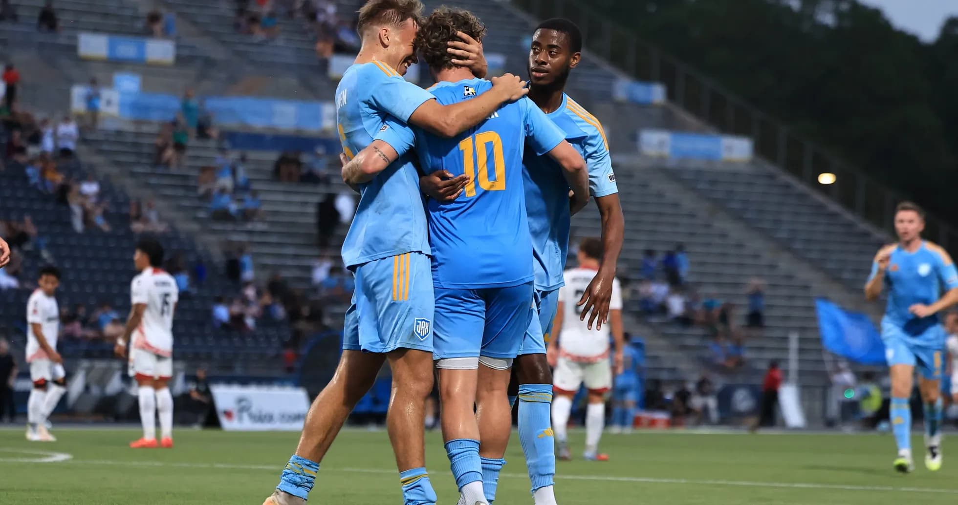 Players celebrating a goal during USL Championship match