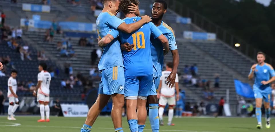 Players celebrating a goal during USL Championship match