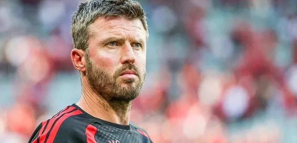 Coach observing during a football match