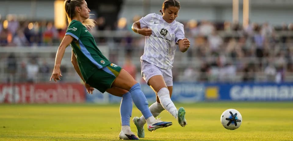 Two players competing for the ball during match
