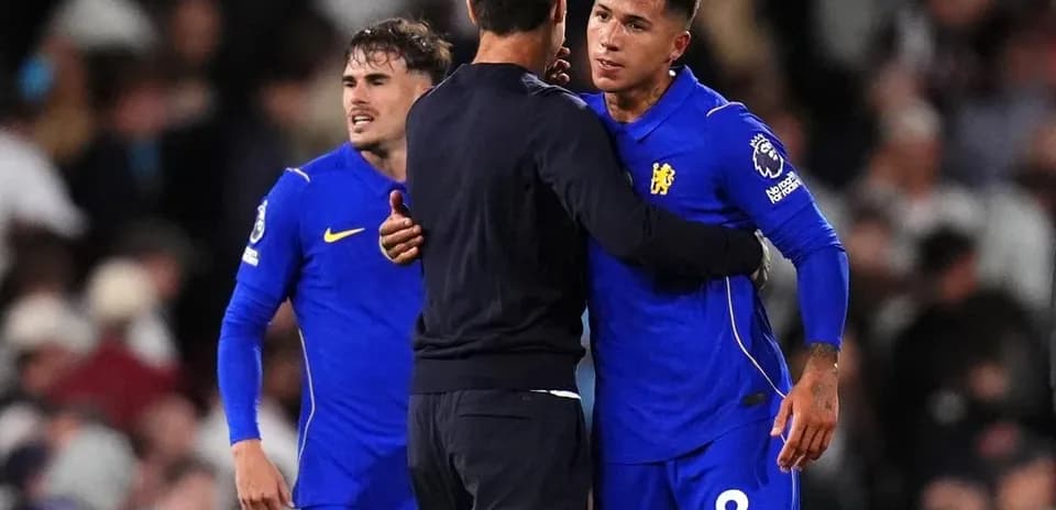 Chelsea players celebrating with coach after match