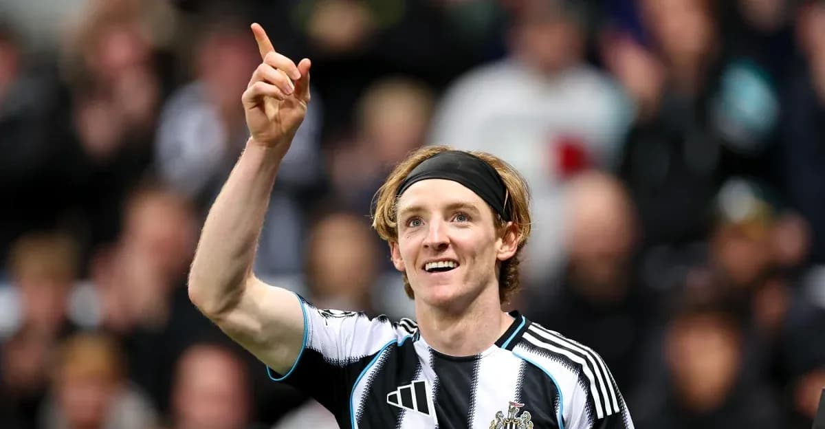 Newcastle player celebrating goal with raised finger