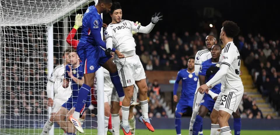Chelsea player attempting a header during match